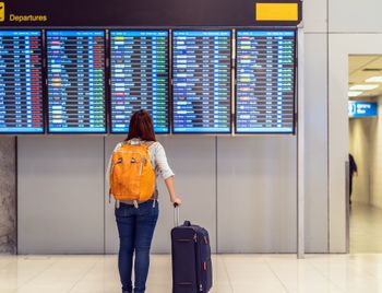 Passenger checking the flight schedule