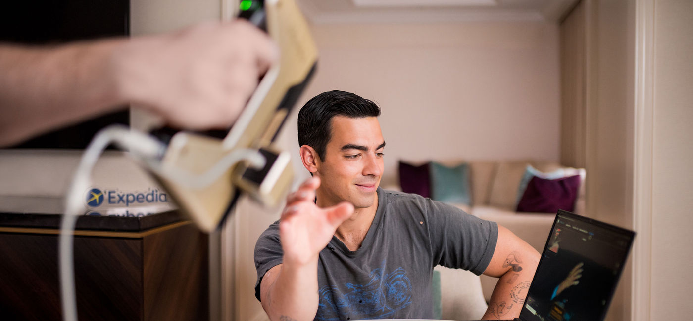 Image: Joe Jonas's right hand is captured to ensure an exact replica for the Expedia Helping Hand. (photo via Expedia Media)