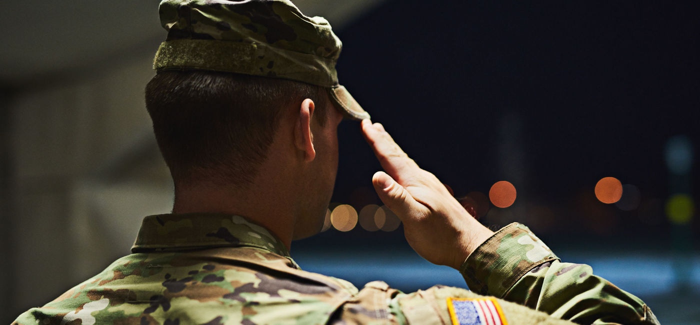 Image: Soldier saluting. (photo via PeopleImages/E+)