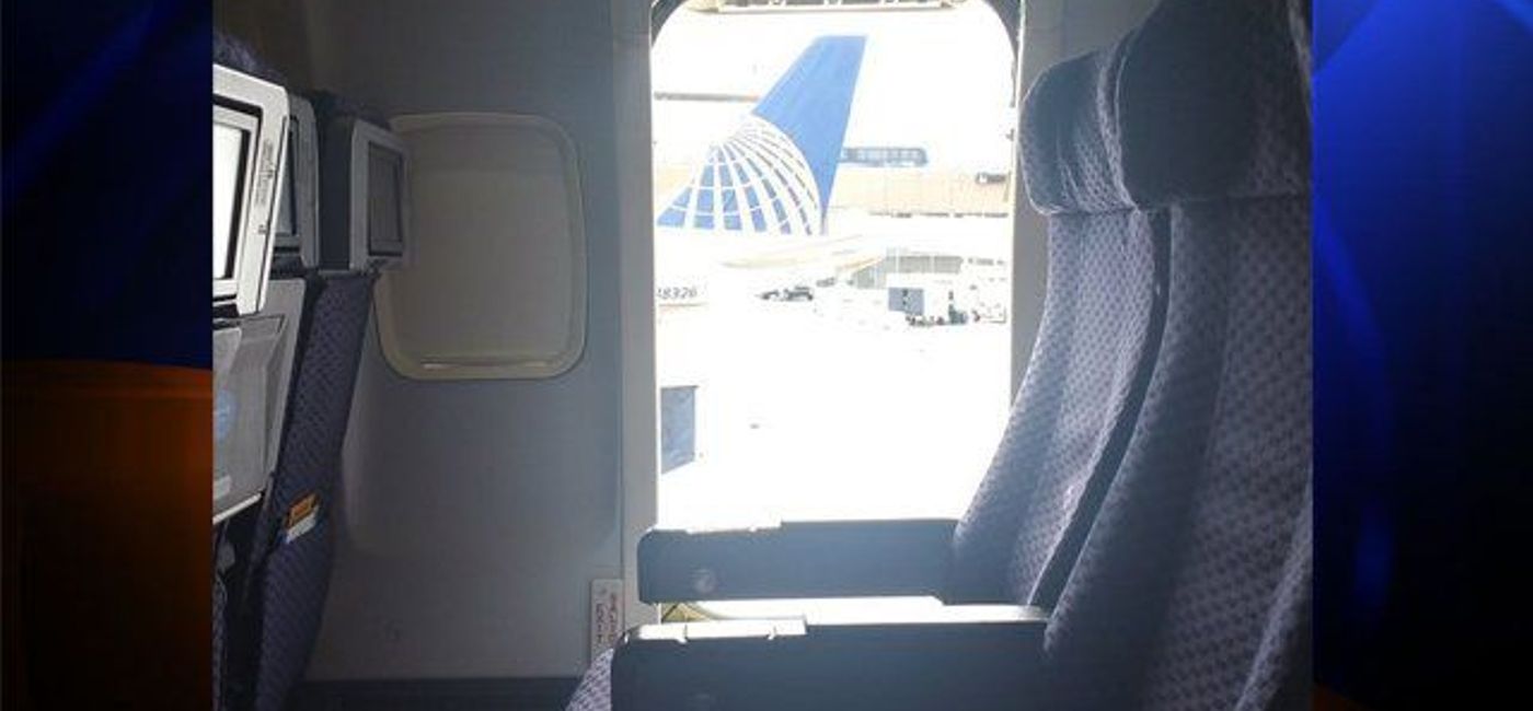 Image: The open emergency door where a woman jumped out at Houston airport.  (Photo via @KLTA)
