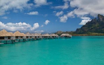 Over-water huts at the Four Seasons Bora Bora