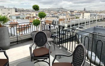 Rooftop in Paris with view of Sacre Coeur basilica