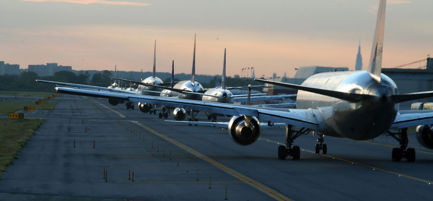 Image: Planes on runway at New York's JFK airport. (photo via XavierMarchant / iStock / Getty Images Plus)