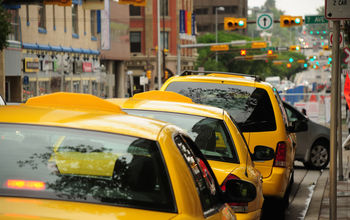 A row of taxis waiting to pick up passengers in Canada.