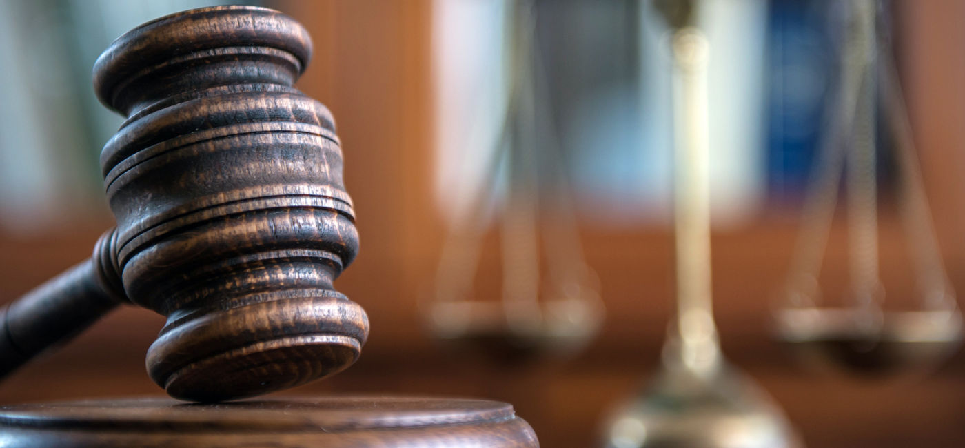 Image: Judge's mallet and the scales of justice. (photo courtesy of Michal Chodyra / iStock / Getty Images Plus)