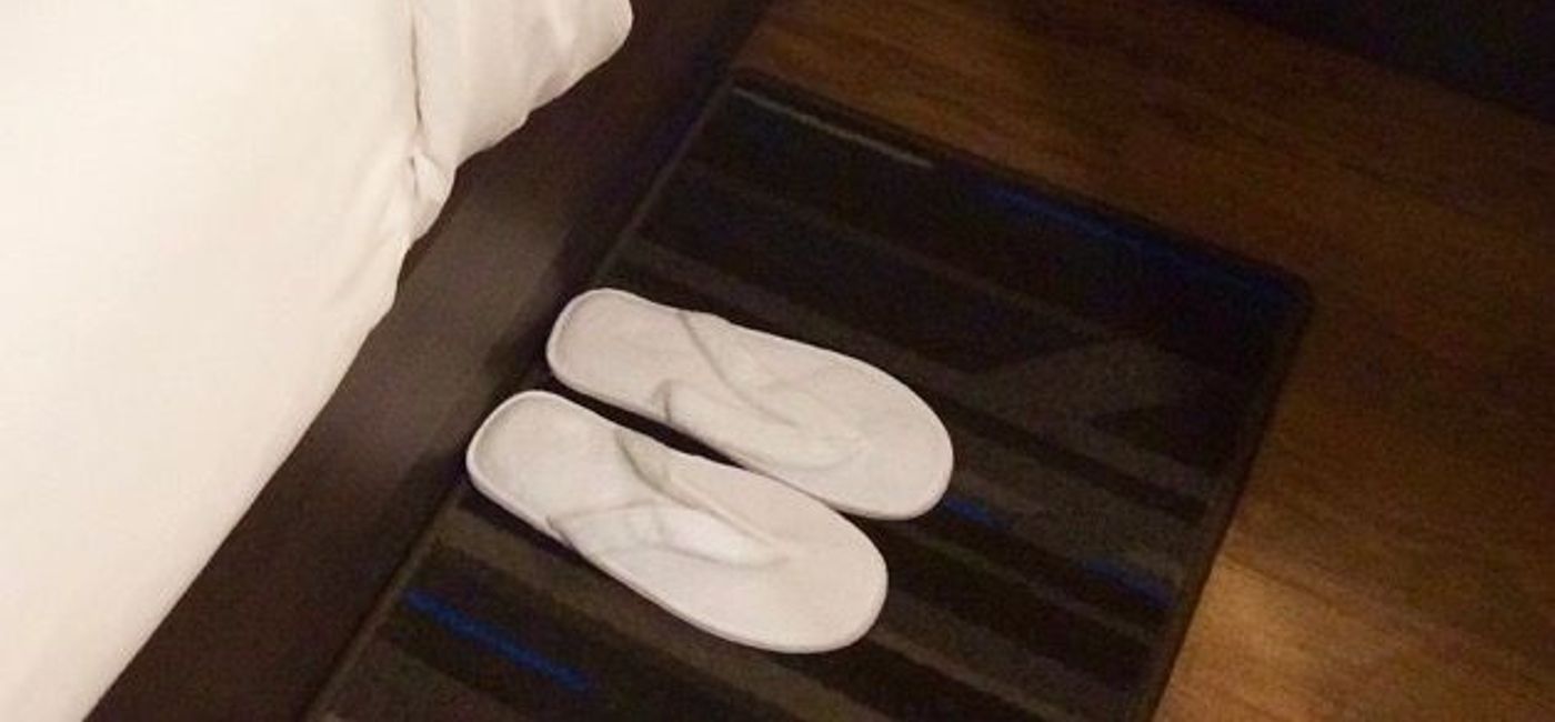 Image: PHOTO: Bedside flip-flops are just one amenity at The Bernic Hotel in New York City. (photo by Scott Laird)