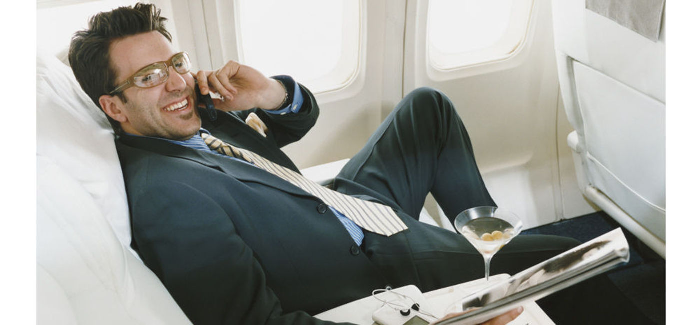 Image: PHOTO: Businessman in an airline cabin. (photo courtesy of Thinkstock)