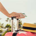 Female traveler with a suitcase at the airport