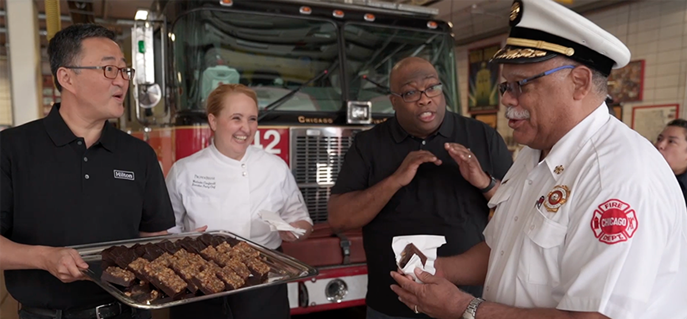 Image: Team Members from The Palmer House in Chicago surprised firefighters of River North’s Engine Co. 42 with a Random Act of Hospitality. (Photo Courtesy of Hilton)