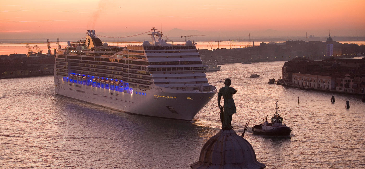 Image: A cruise ship sailing the Giudecca Canal in Venice. (photo via Mark Edward Smith/iStock/Getty Images Plus)