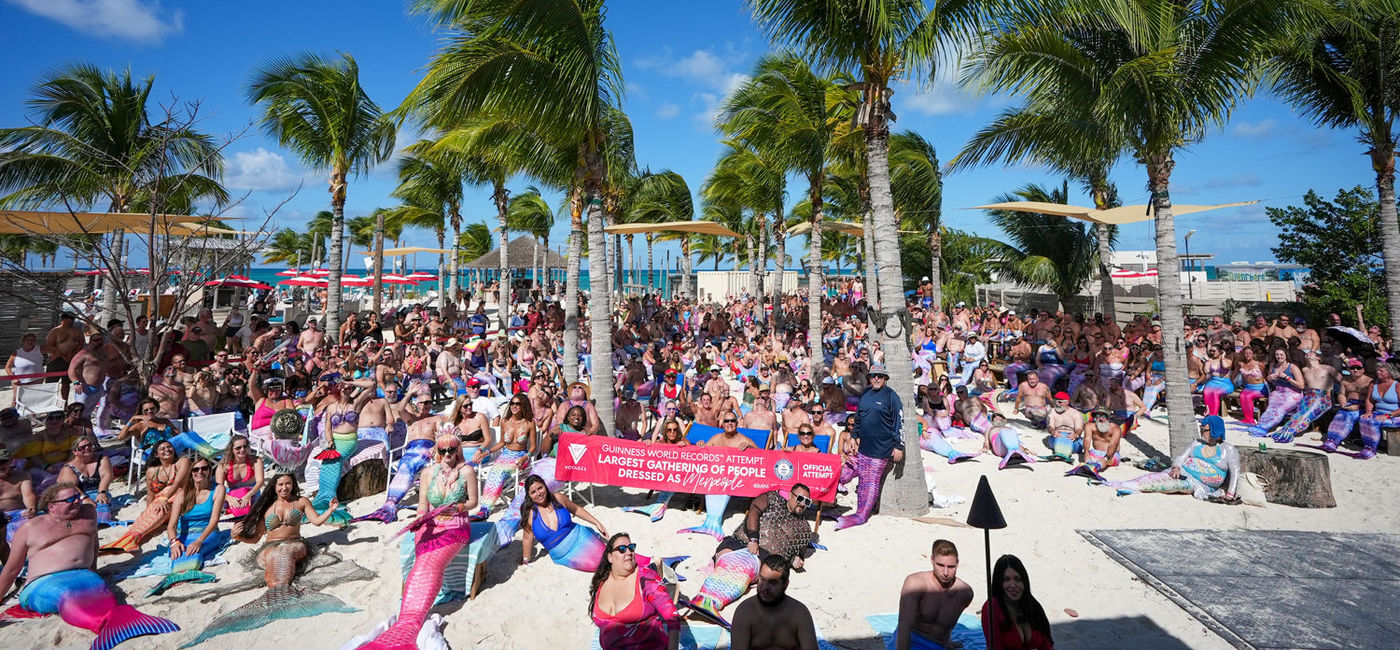 Image: Merpeople gathered at Virgin Voyages Beach Club in Bimini. (photo courtesy of Virgin Voyages)