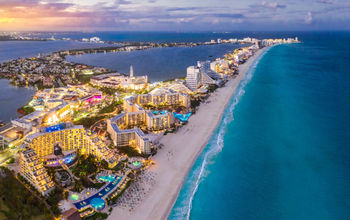 Cancun beach coast at sunset.