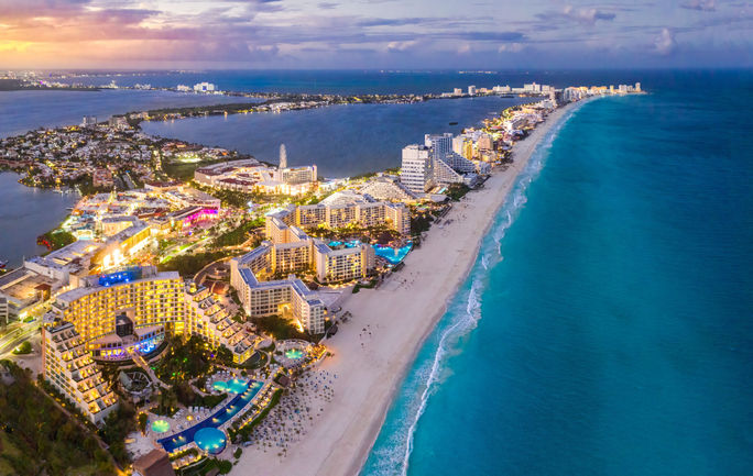 Cancun beach coast at sunset.