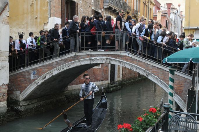 Tourists in the crowded bridge in Venice, Italy Editorial Use Only - Tourists in the crowded bridge in Venice, Italy