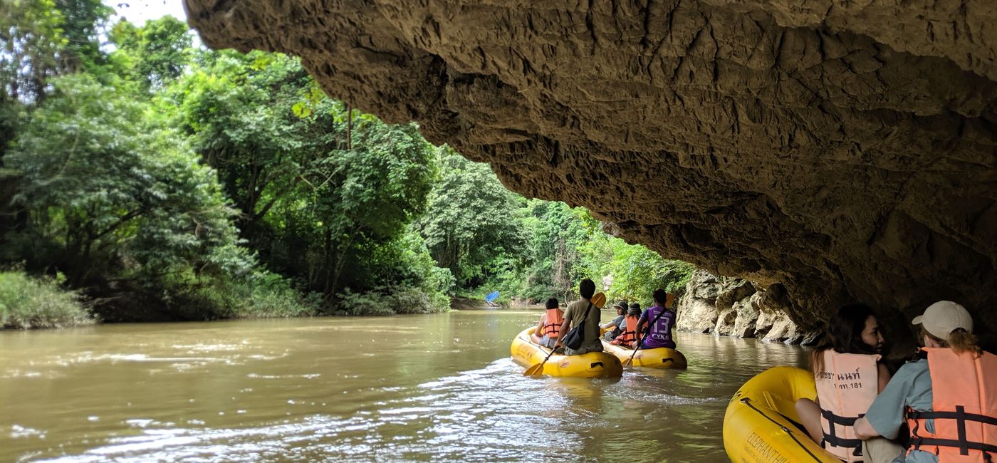 Image: Kayaking under a cliff on the Sok River. (photo via Alex Temblador)