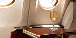 Champagne provided at a passenger's airplane seat.