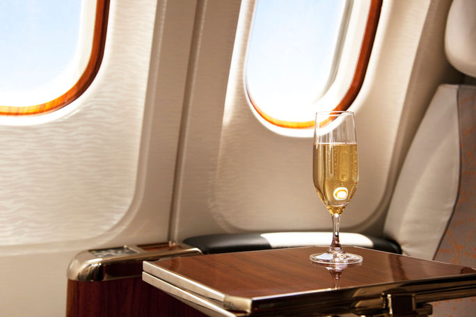 Champagne provided at a passenger's airplane seat.