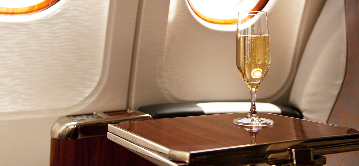 Image: PHOTO: Champagne provided at a passenger's airplane seat. (Photo via iStock/Getty Images Plus/Bertlmann)