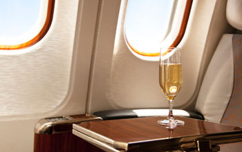 Champagne provided at a passenger's airplane seat.