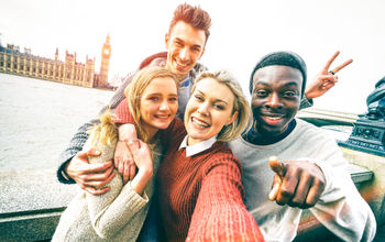 Group of friends taking a selfie in London.