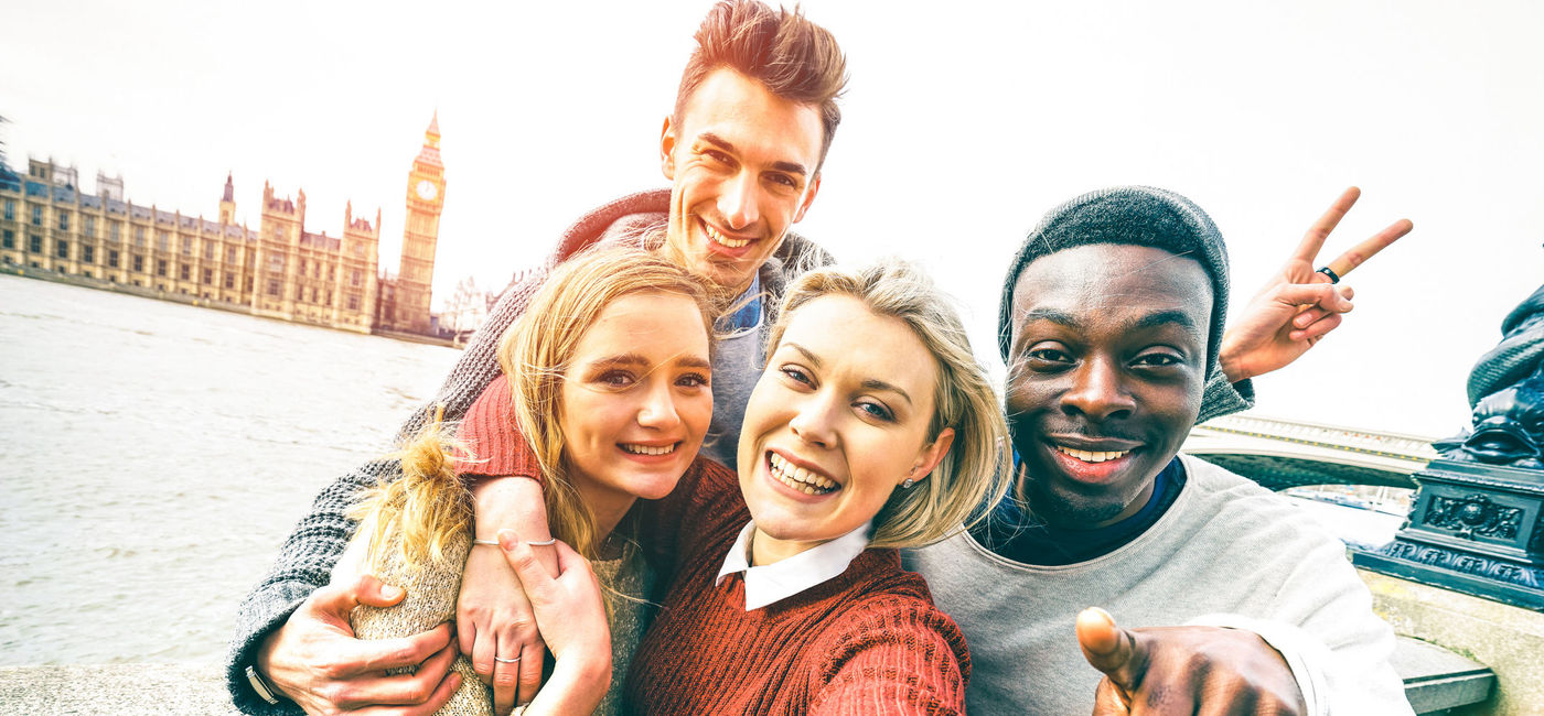 Image: Group of friends taking a selfie in London. (Photo via iStock / Getty Images Plus / ViewApart)