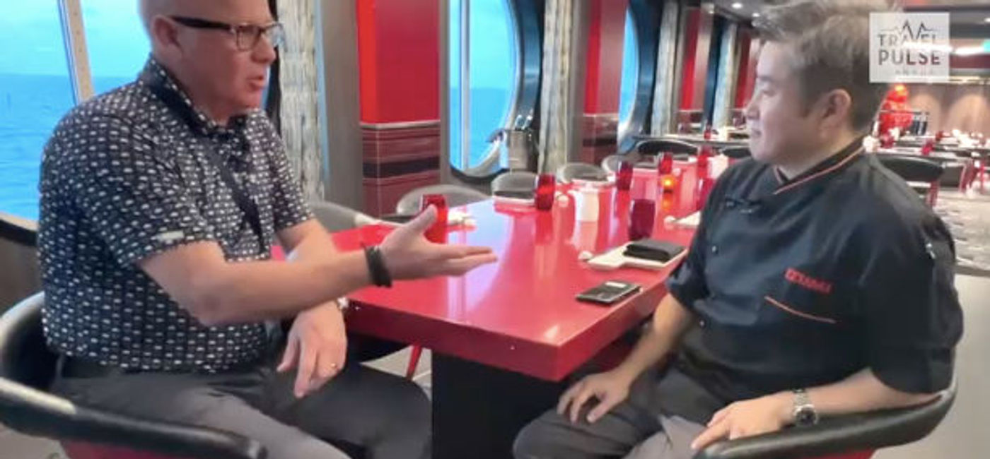 Image: John Kirk with Travis Kamiyama - Sushi Jedi and Chef for Izumi onboard Royal Caribbean. (TravelPulse Canada)