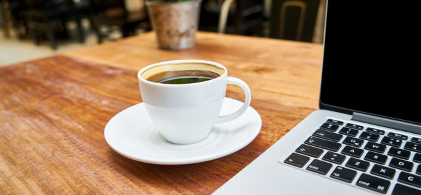 Image: PHOTO: Coffee and computer at the kitchen table. (photo via Pixabay/Engin_Akyurt)