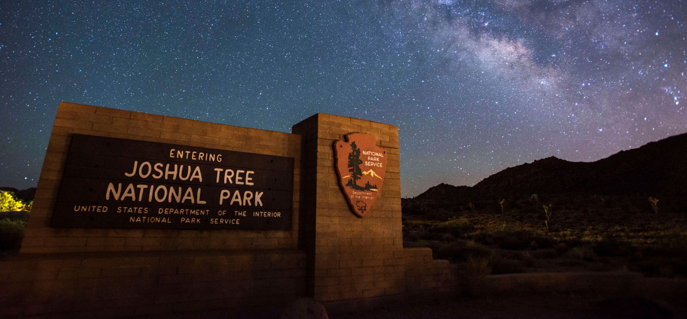 Image: Joshua Tree National Park sign under the stars (Photo via NPS/Lian Law) ((photo via NPS/Lian Law))