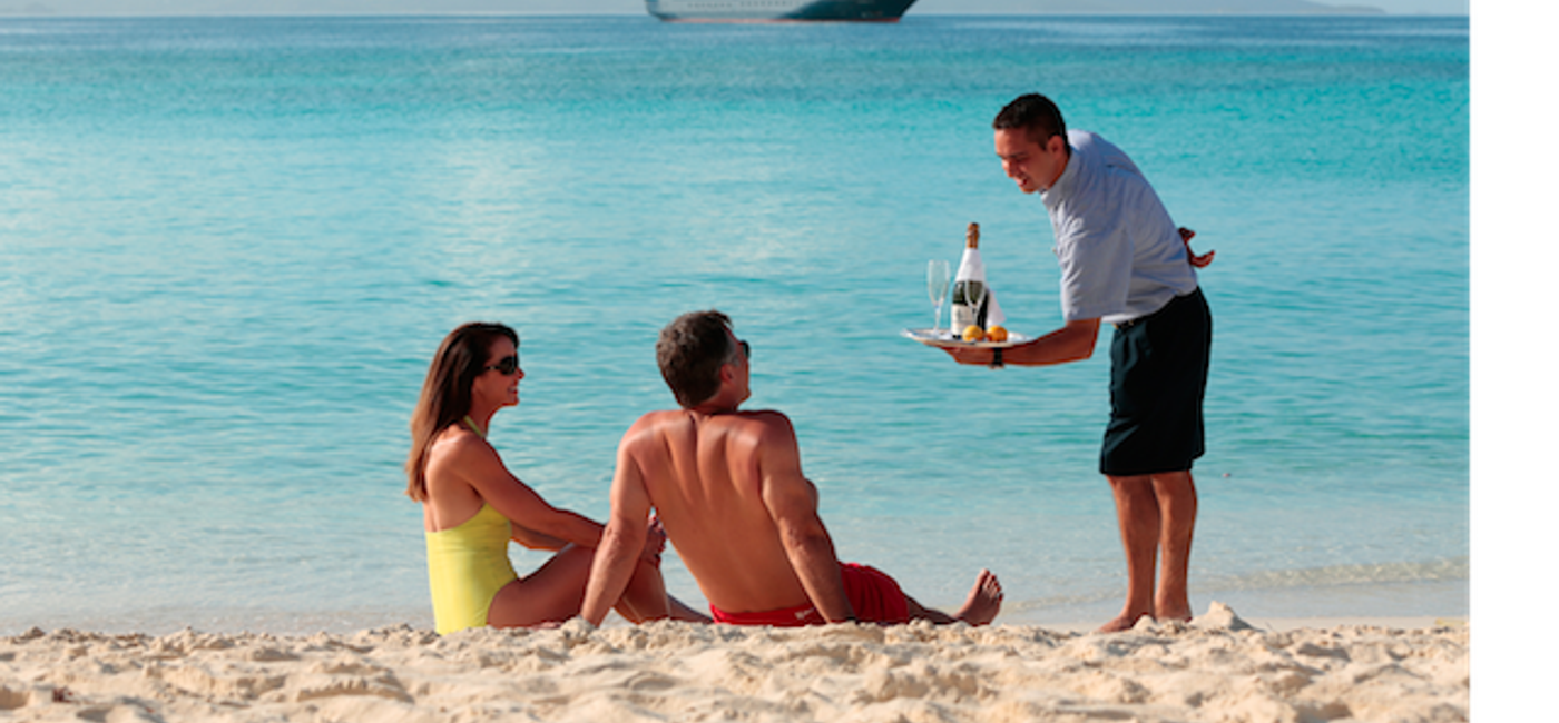 Image: PHOTO: Now that’s service! SeaDream serves couples champagne on the beach. (photo courtesy of SeaDream Yacht Club)