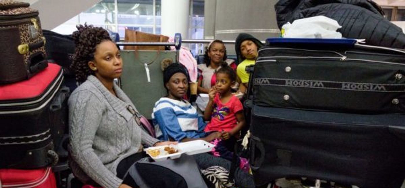 Image: Bride sits as her cancled flight means a cancelled wedding.  (Stabroek News)