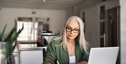 Travel advisor taking notes at home