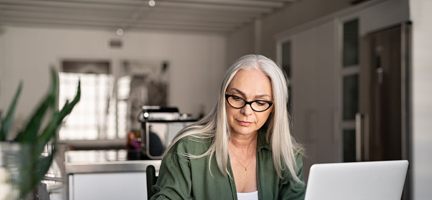 Image: Travel advisor taking notes at home. (photo via Ridofranz/iStock/Getty Images Plus)