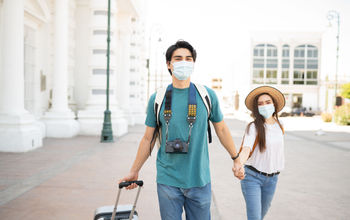 Couple in face masks on vacation in Mexico City.