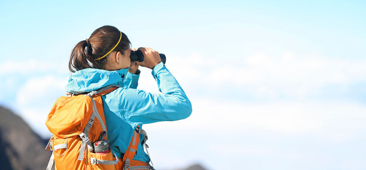 Image: PHOTO: Hiker searching with binoculars. (photo courtesy of Thinkstock)
