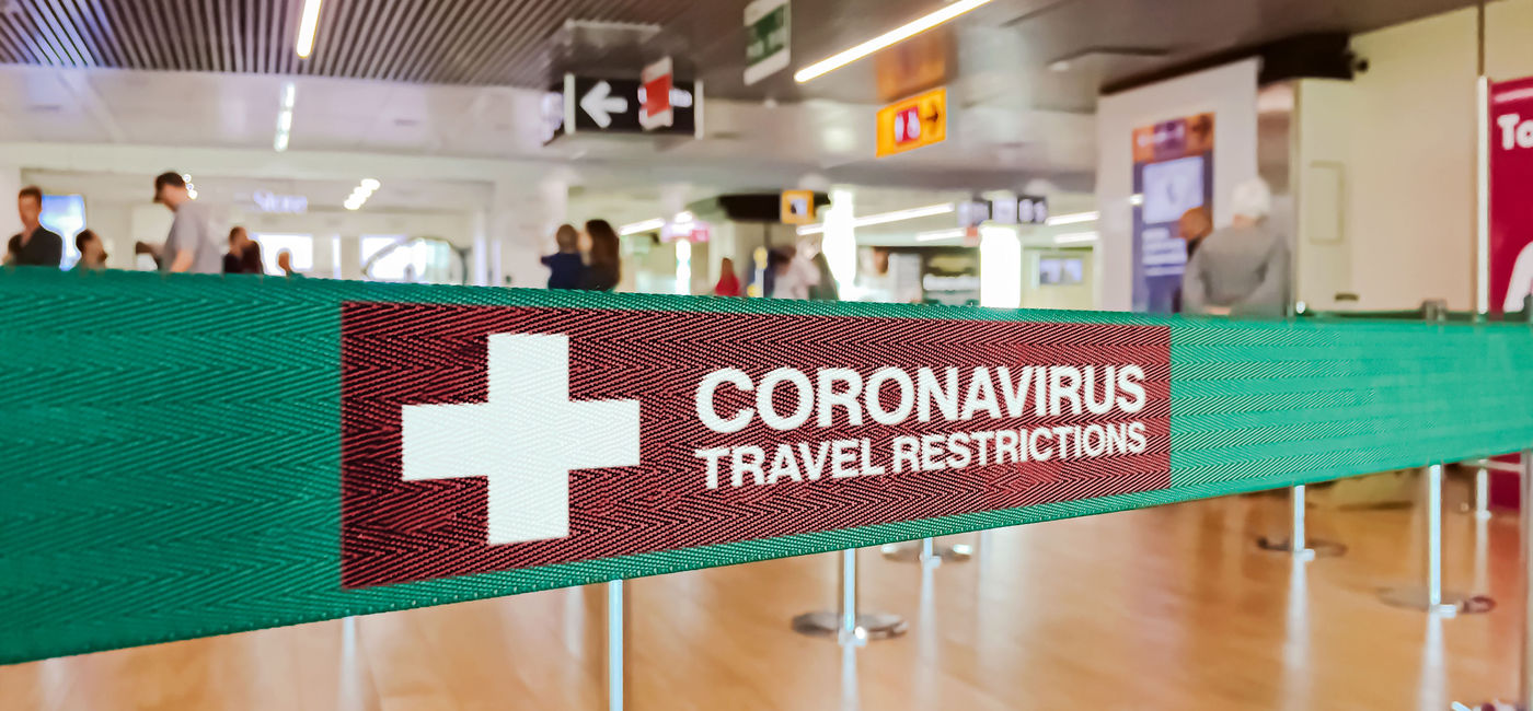 Photo: Warning of travel restriction in airport (Photo via rarrarorro / iStock / Getty Images Plus)