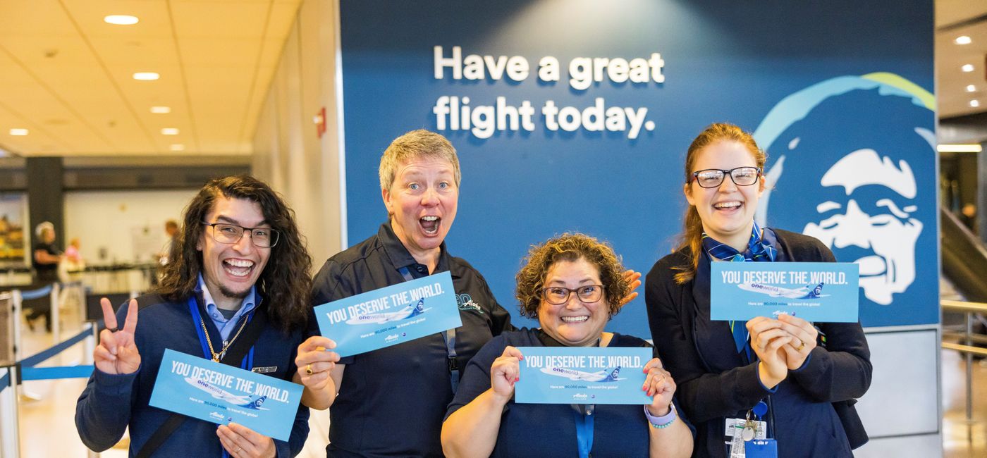 Image: Alaska Airlines employees pose with their 90,000 mile vouchers. (photo via Ingrid Barrentine) ((photo via Ingrid Barrentine))