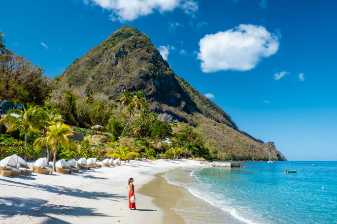 A tourist enjoying Saint Lucia's Sugar Beach