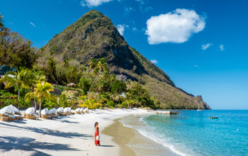 A tourist enjoying Saint Lucia's Sugar Beach