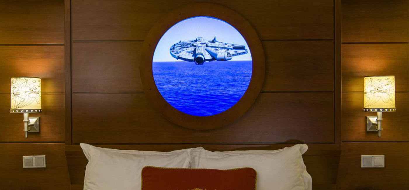 Image: PHOTO: The Millennium Falcon passes by a Magical Porthole during Disney Cruise Line's Star Wars Day at Sea. (photo courtesy of Disney Cruise Line/Matt Stroshane, photographer)