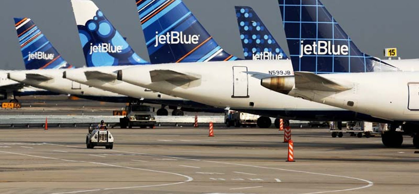 Image: PHOTO: A row of JetBlue Airbus A320 aircraft tail fins. (photo courtesy of JetBlue)