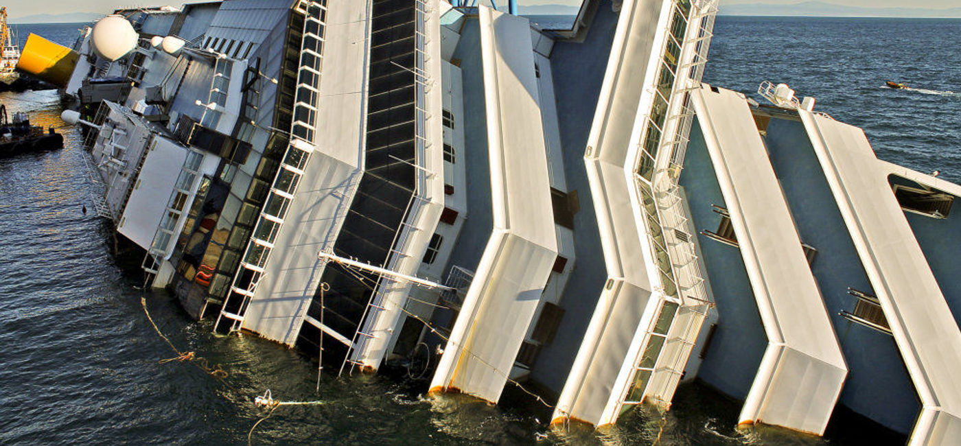 Image: PHOTO: The Costa Concordia after it capsized off the coast of Giglio Island. (photo via Flickr/John Ferguson)