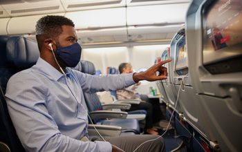 A passenger enjoying in-flight entertainment