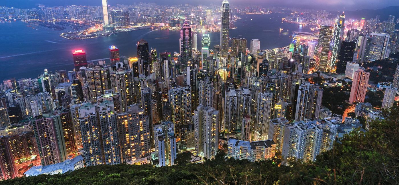 Image: Hong Kong viewed from the top of Victoria Peak. (photo via P. Kijsanayothin/iStock/Getty Images Plus)