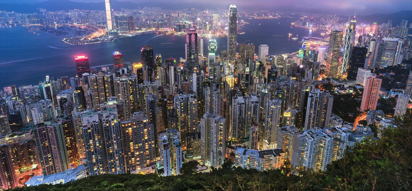 Image: PHOTO: Hong Kong viewed from the top of Victoria Peak. (photo via P. Kijsanayothin/iStock/Getty Images Plus)
