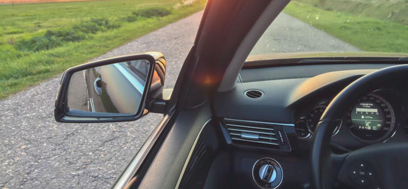 Image: PHOTO: Car driving down a sunlit road. (Photo courtesy of Thinkstock)