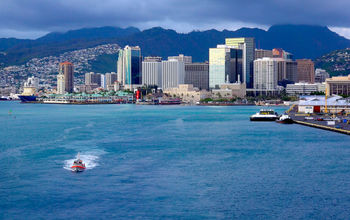 View of downtown Honolulu, Oahu from the deck of a cruise ship as it heads out to sea