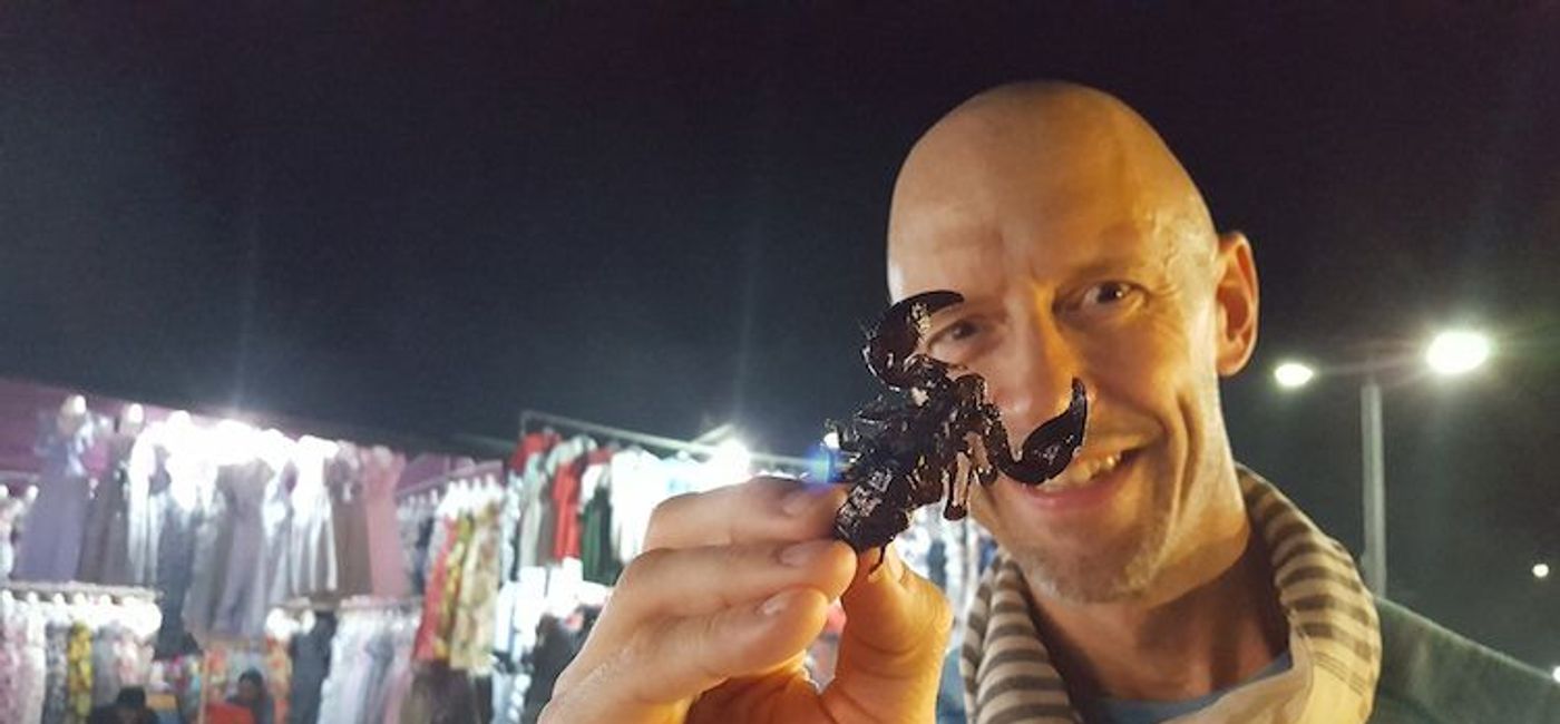 Image: PHOTO: The author samples all manner of exotic cuisine on a food tour of Siem Reap. (photo by John Roberts)