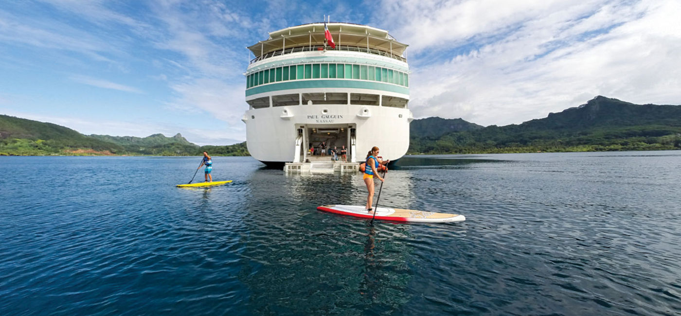 Image: Paddleboarding in the watersports marina. (photo via Paul Gauguin Cruises)