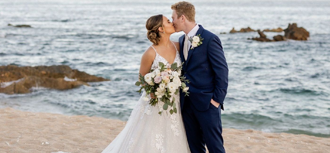 Image: Wedding couple on the beach. (photo by Sara Richardson Photo via La Coleccion Resorts by Fiesta Americana)