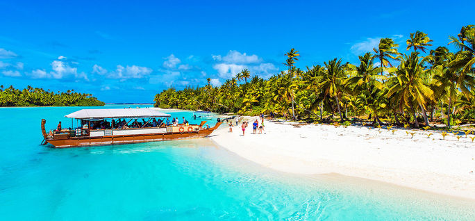 Boat on a sandy beach in Aitutaki island, Cook Islands